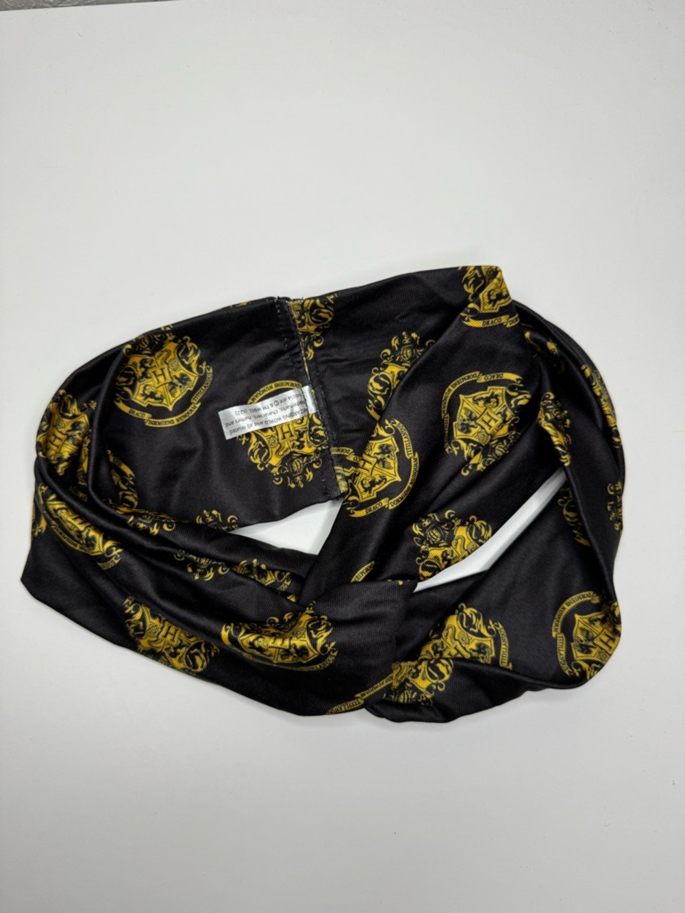 NWOT Harry Potter Brand Black and Gold Hogwarts Crest Logo Headband